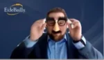 Man in a humorous disguise with a large fake nose, oversized glasses, and a mustache on a blue background with the Eide Bailly logo visible.