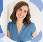 Smiling woman with shoulder-length brown hair wearing a blue denim shirt, posing against a light background with circular decorative shapes around her.
