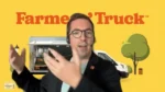 Presenter with a headset gesturing in front of a bright yellow backdrop that says 'Farmer's Truck' with a delivery van and trees in the background.